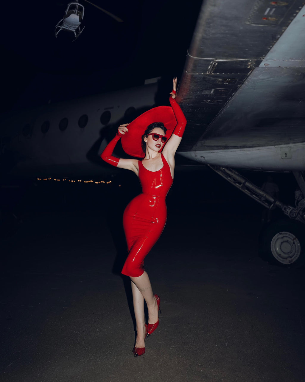 The same latex midi dress in red, full length