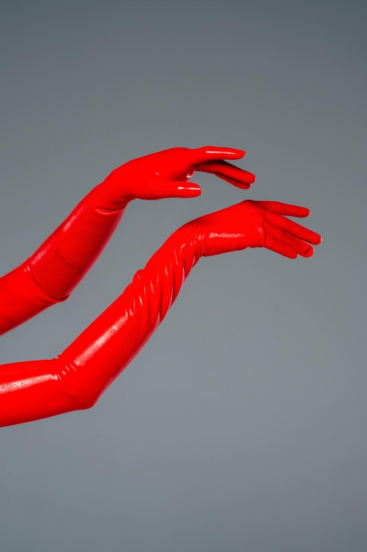 Red latex gloves, detail of the hand and forearm