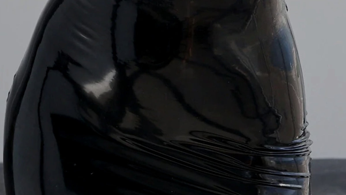 Black latex fitted to the waist